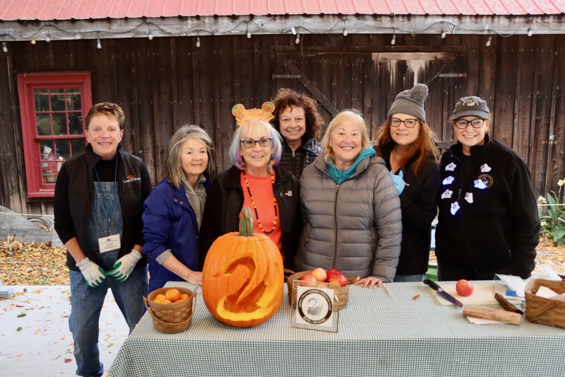 A pumpkin with the Zwaanendael Women’s Club logo makes a fitting prop for a group photo of some of the pumpkin carvers. Shown are (l-r) Sarah Sampson, Carmen Tucker, Pat Evens, Deb Cebula, Lisa Burnham, Karen Kabat and Kathleen Decataldo.